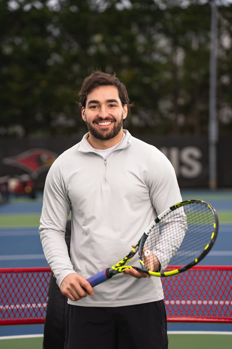 Private tennis lesson in Seattle with coach demonstrating forehand technique and footwork fundamentals.